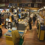 Customers browsing vinyl and merchandise in a record store