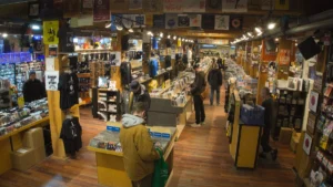 Customers browsing vinyl and merchandise in a record store
