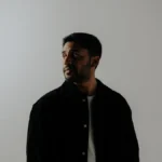 Singer-songwriter Josh Sahunta in a studio portrait